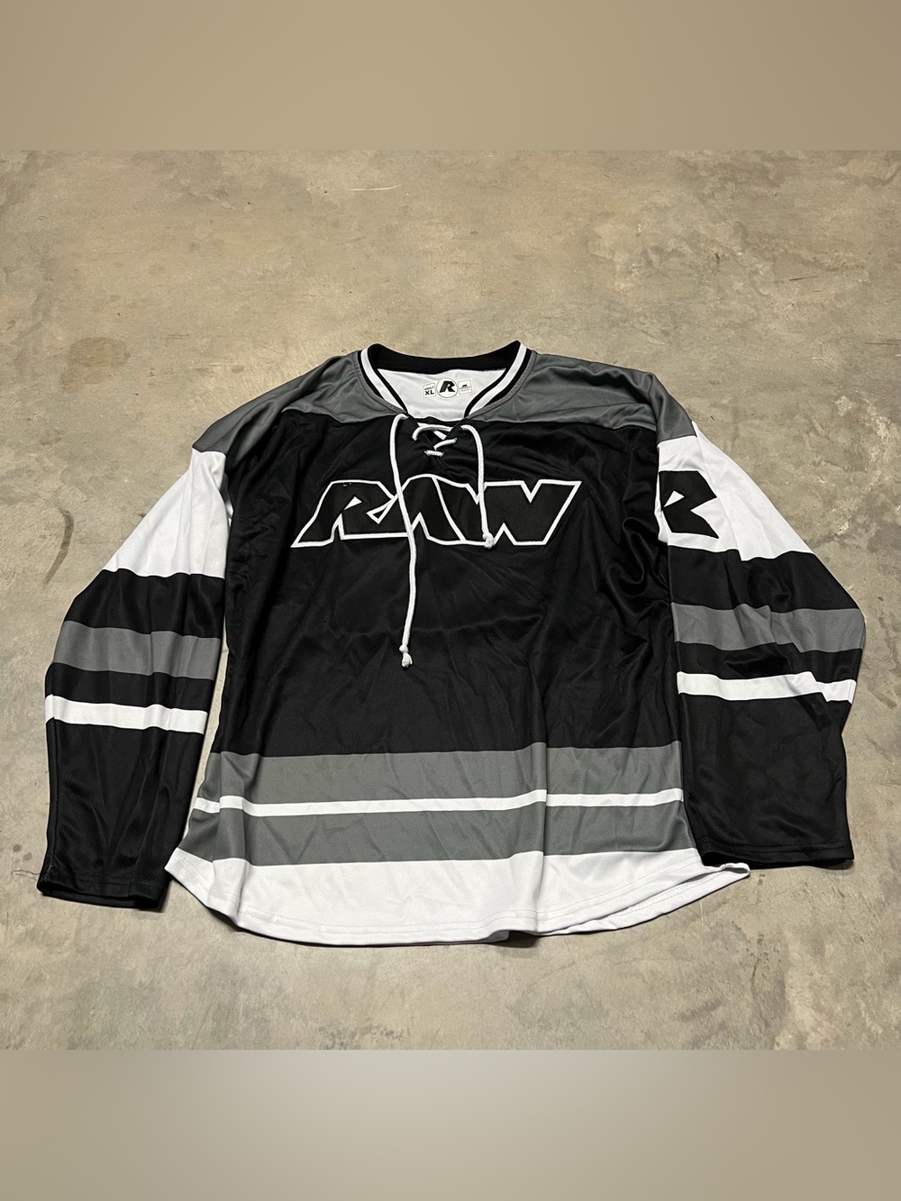 Raw Nutrition Cotapaxi hockey jersey with a lace-up neck black and grey Adult XL